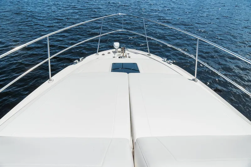 L'attitude Adjustment Yacht Photos Pics Bow view of 2001 Sea Ray 540 Cockpit Motor Yacht on open water.