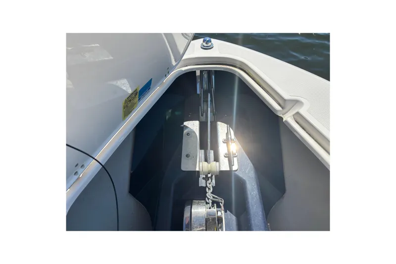  Yacht Photos Pics 2014 Pursuit C 310 Center Console anchor compartment with sunlight reflection.