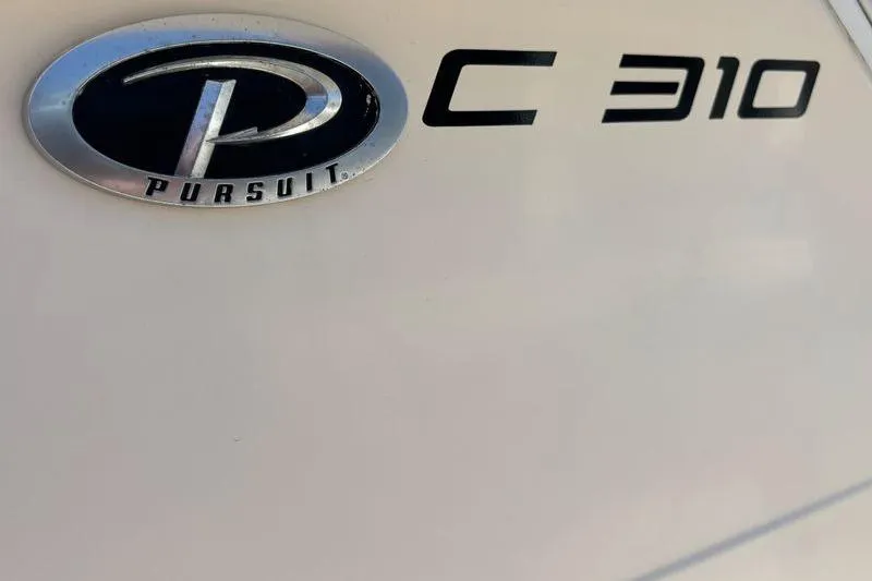  Yacht Photos Pics 2014 Pursuit C 310 Center Console logo and model name on boat exterior.