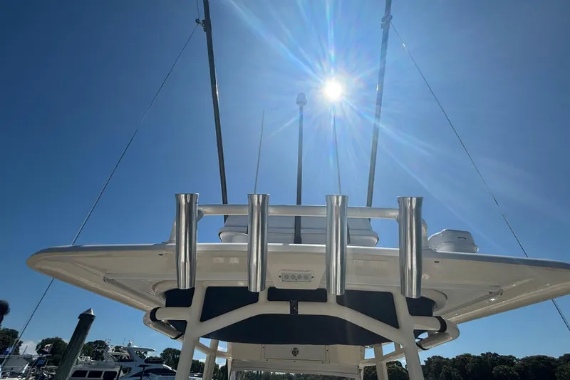 Yacht Photos Pics 2014 Pursuit C 310 Center Console boat under bright sun with clear blue sky.