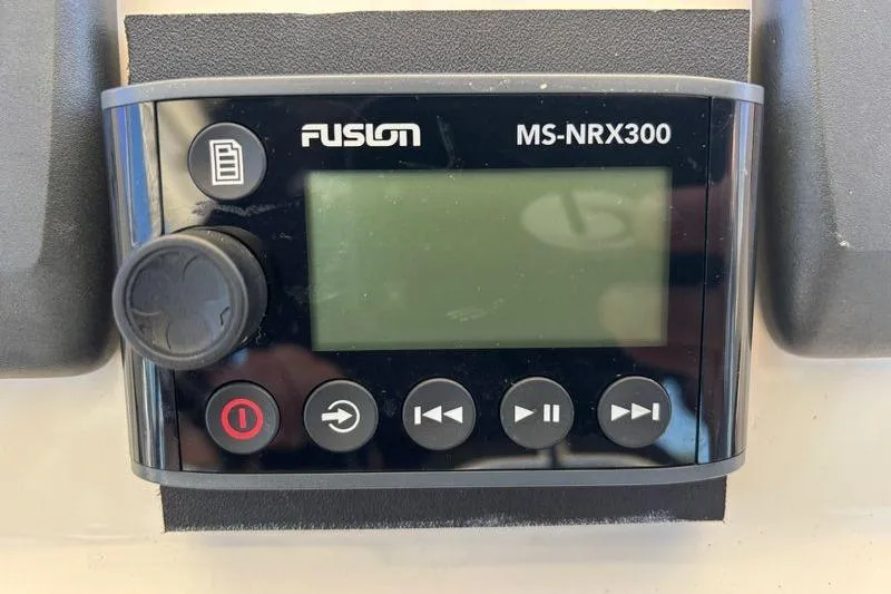  Yacht Photos Pics Fusion MS-NRX300 marine stereo controller on 2014 Pursuit C 310 Center Console.