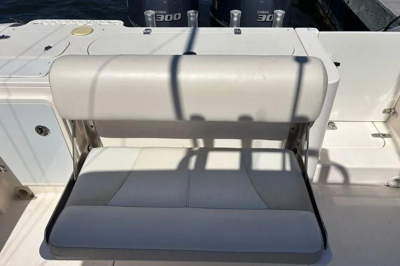  Yacht Photos Pics 2014 Pursuit C 310 Center Console boat seat with Yamaha 300 engines in background.