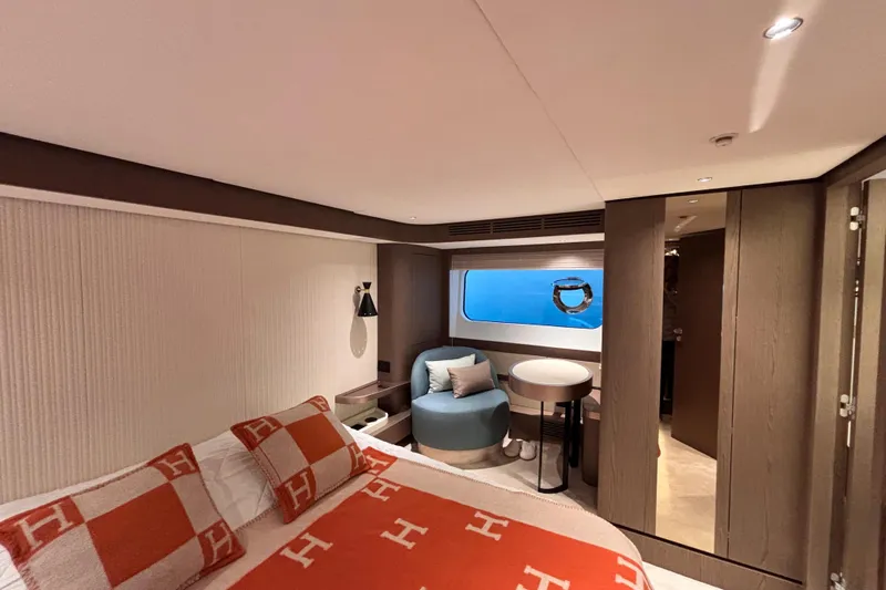 T&b Yacht Photos Pics Luxurious cabin interior of 2025 Azimut Magellano 66 yacht with modern furnishings.