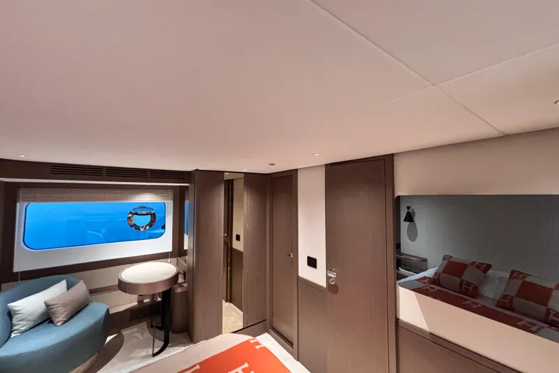 T&b Yacht Photos Pics Luxurious interior of 2025 Azimut Magellano 66 yacht cabin with modern furnishings.
