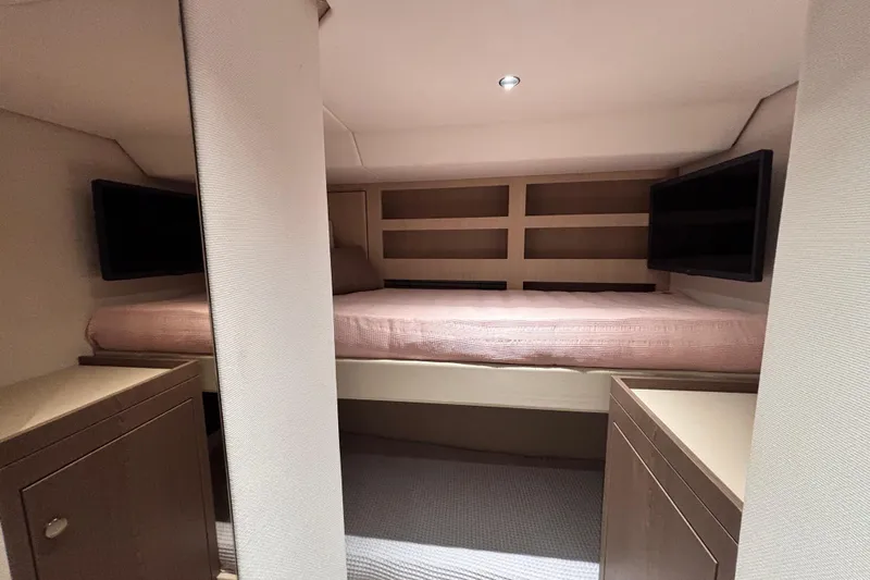 T&b Yacht Photos Pics Luxurious cabin interior of 2025 Azimut Magellano 66 yacht with cozy bed and modern decor.