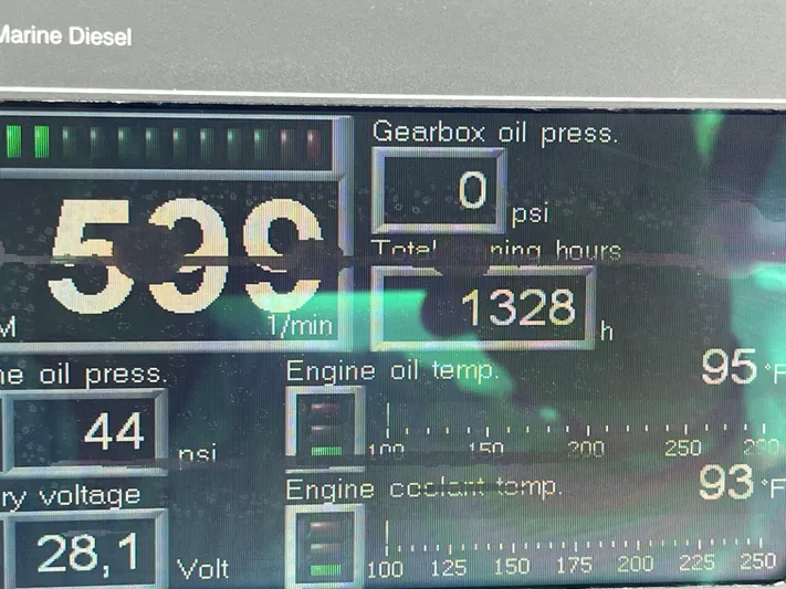 Greatest Escape Yacht Photos Pics Close-up of 2006 Sea Ray 58 Sedan Bridge engine display showing various performance metrics.