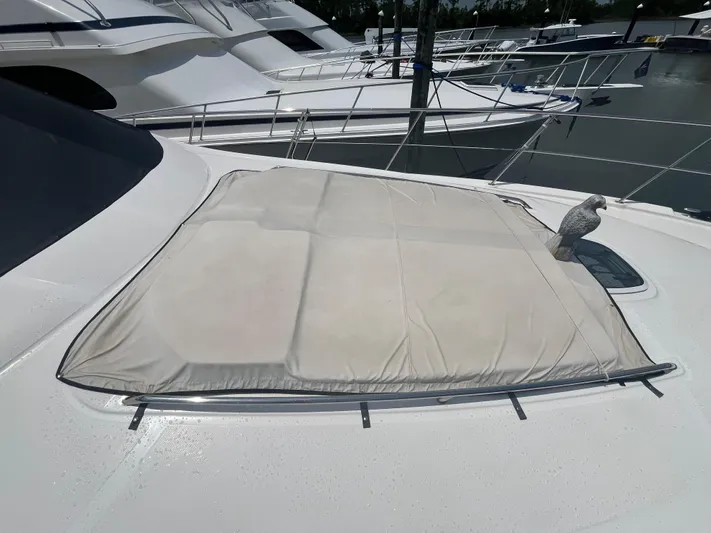 Greatest Escape Yacht Photos Pics 2006 Sea Ray 58 Sedan Bridge yacht with covered deck area.