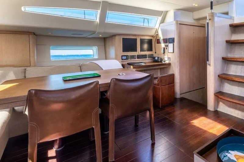 Ych2 Yacht Photos Pics Luxurious interior of 2009 Nautor Swan 90 yacht with elegant wood finishes and modern navigation equipment.