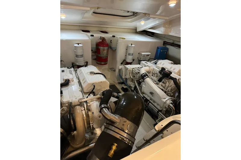  Yacht Photos Pics Engine room of 2014 Tiara Yachts 4300 Open, featuring dual engines and fire extinguisher.