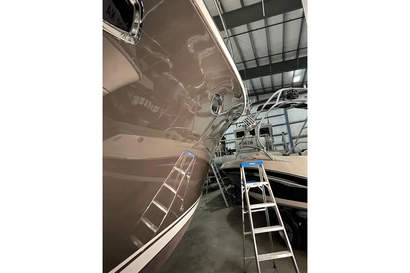  Yacht Photos Pics 2014 Tiara Yachts 4300 Open in storage, with ladder beside hull.