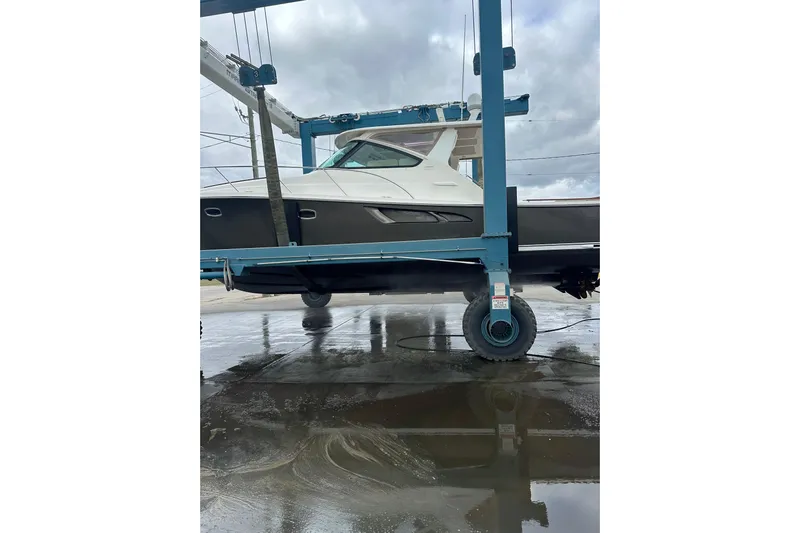  Yacht Photos Pics 2014 Tiara Yachts 4300 Open on a lift, showcasing sleek design and craftsmanship.