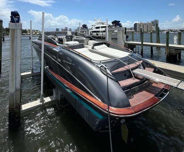 Lady D Yacht Photos Pics 2015 Riva Rivarama Super yacht docked at marina, featuring sleek design and luxurious seating.
