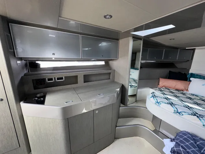 Lady D Yacht Photos Pics Luxurious interior of a 2015 Riva Rivarama Super yacht with modern cabinetry and cozy bedding.