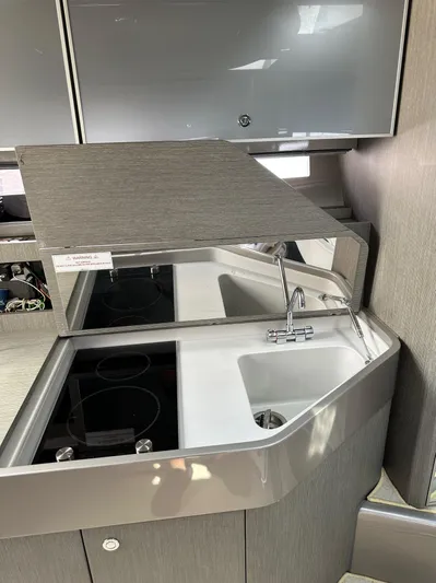 Lady D Yacht Photos Pics 2015 Riva Rivarama Super yacht kitchen with modern sink and stovetop.