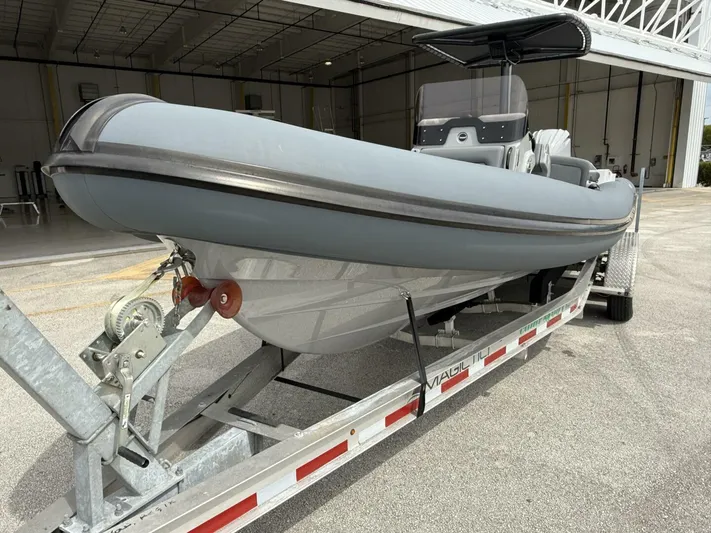  Yacht Photos Pics 2022 Ribeye 8.1m Outboard BL boat on trailer in a hangar.