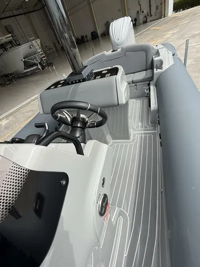  Yacht Photos Pics 2022 Ribeye 8.1m Outboard BL boat interior with steering wheel and seating.