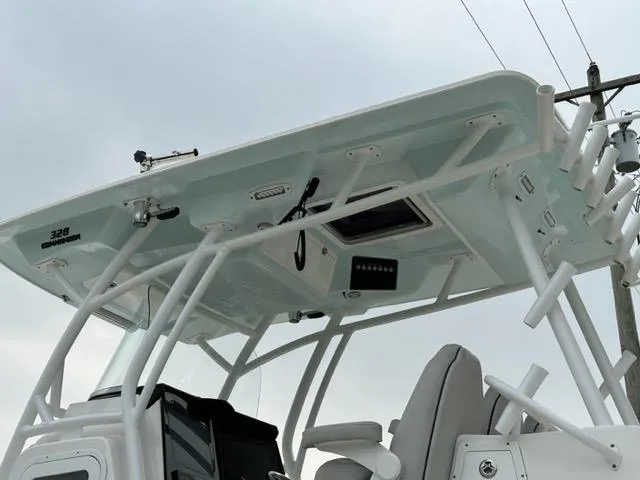 Middle Man Yacht Photos Pics 2019 Sea Fox 328 Commander boat, featuring a sleek T-top and modern design elements.