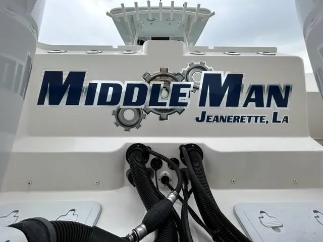Middle Man Yacht Photos Pics Sea Fox 328 Commander boat with "Middle Man" and "Jeanerette, LA" text on the stern.