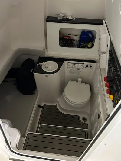 Middle Man Yacht Photos Pics 2019 Sea Fox 328 Commander boat interior with toilet and sink.
