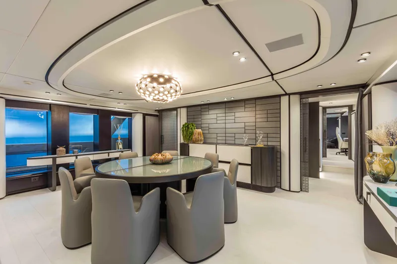 X130 Triplex Yacht Photos Pics Luxurious dining area in the 2026 Extra X130 TRIPLEX yacht with modern decor.