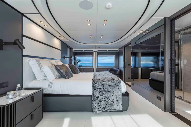 X130 Triplex Yacht Photos Pics Luxurious bedroom interior of the 2026 Extra X130 TRIPLEX yacht with ocean view.