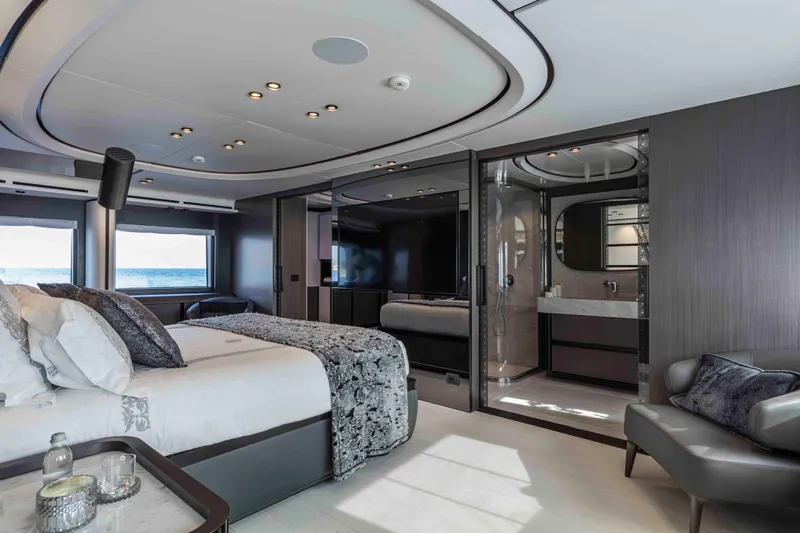 X130 Triplex Yacht Photos Pics Luxurious bedroom interior of 2026 Extra X130 TRIPLEX yacht with ocean view.