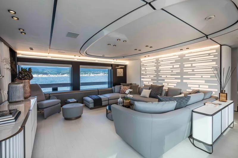 X130 Triplex Yacht Photos Pics Luxurious living area on the 2026 Extra X130 TRIPLEX yacht with modern decor and panoramic windows.