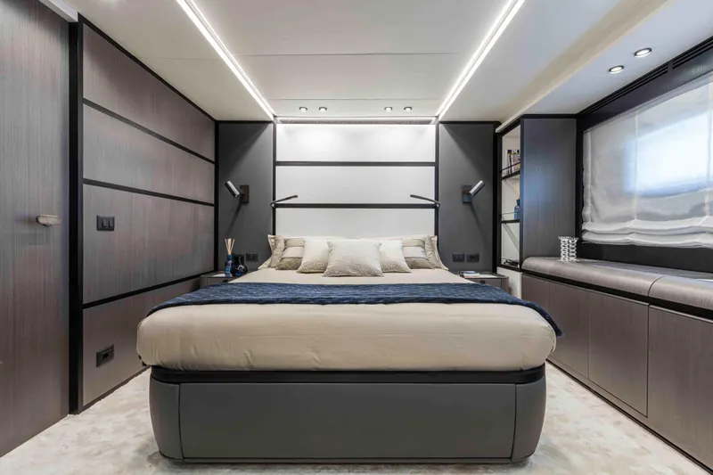 X130 Triplex Yacht Photos Pics Luxurious bedroom interior of Extra X130 TRIPLEX yacht, 2026 model, featuring modern design and ambient lighting.