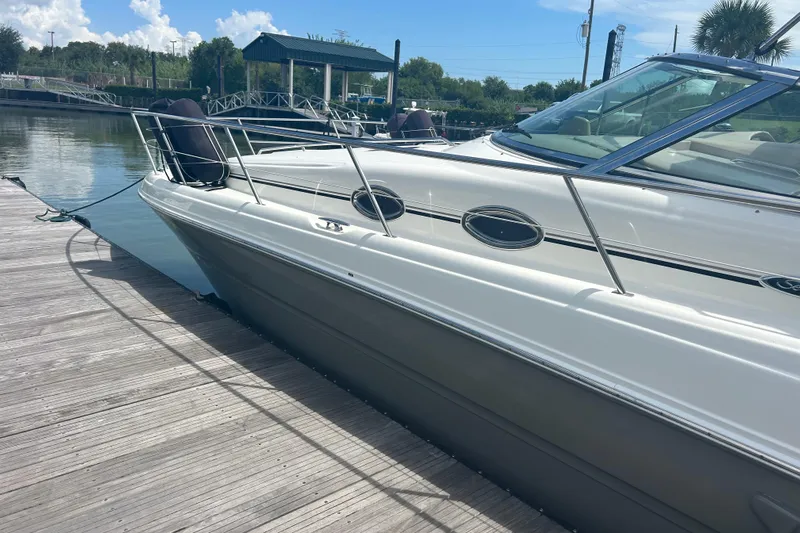 Whataboat Yacht Photos Pics 2005 Sea Ray 360 Sundancer docked at a marina on a sunny day.