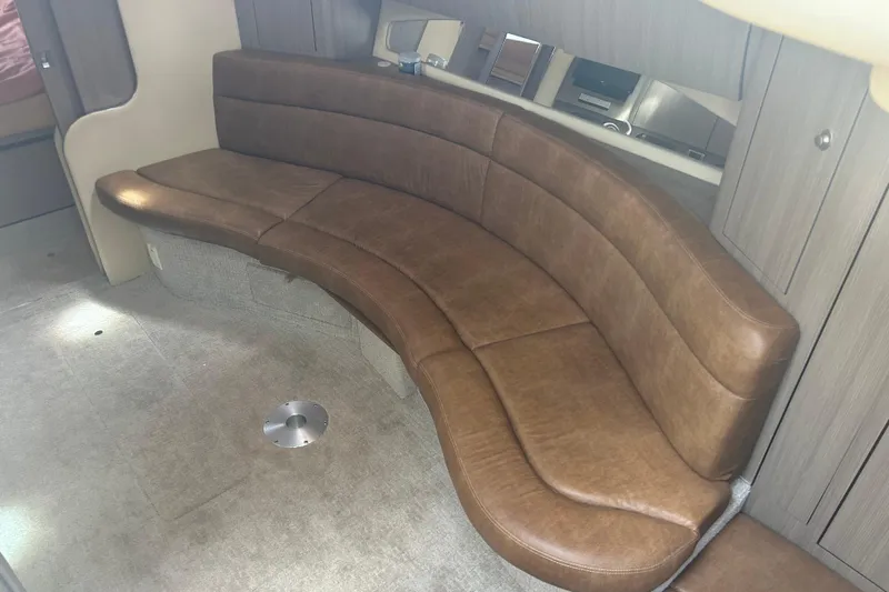 Whataboat Yacht Photos Pics Luxurious brown leather seating in 2005 Sea Ray 360 Sundancer cabin interior.
