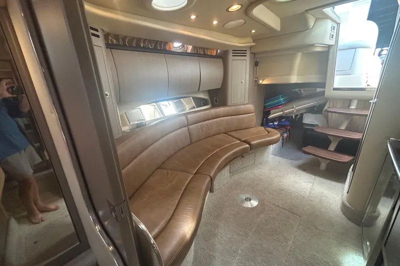 Whataboat Yacht Photos Pics Interior of 2005 Sea Ray 360 Sundancer with curved leather seating and modern design.