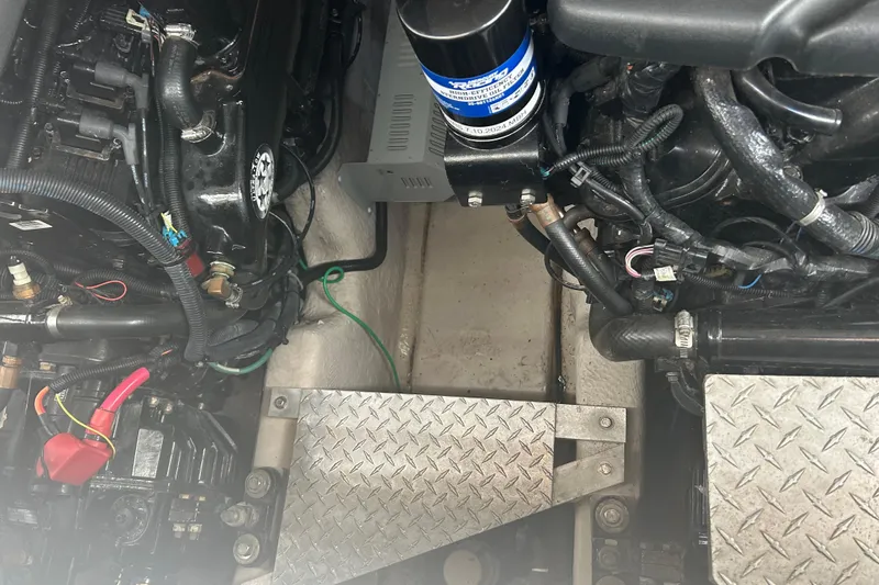 Whataboat Yacht Photos Pics Engine compartment of a 2005 Sea Ray 360 Sundancer boat, showing mechanical components.
