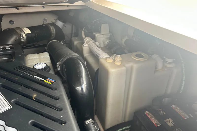 Whataboat Yacht Photos Pics Engine compartment of a 2005 Sea Ray 360 Sundancer, showing various components and hoses.