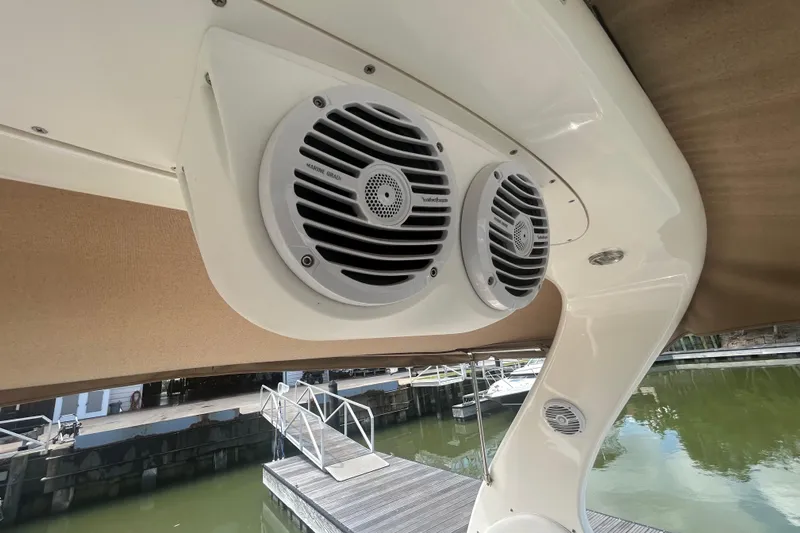 Whataboat Yacht Photos Pics Marine speakers on a 2005 Sea Ray 360 Sundancer boat, docked by the water.