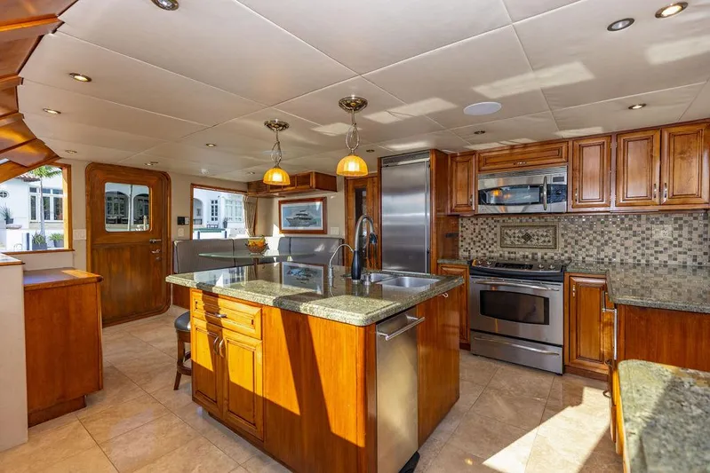 Empire Sea Yacht Photos Pics Luxurious yacht kitchen with wooden cabinets and modern appliances, built in 2009.