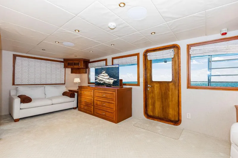 Empire Sea Yacht Photos Pics Interior of a 2009 Custom Crystal Yacht with sofa and TV.