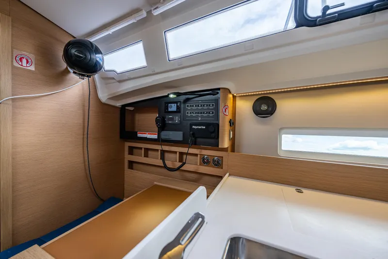 Into The Blue Yacht Photos Pics Interior of 2022 Jeanneau Sun Odyssey 410 yacht, featuring modern navigation equipment and sleek design.
