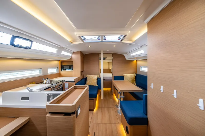 Into The Blue Yacht Photos Pics Luxurious interior of 2022 Jeanneau Sun Odyssey 410 sailboat with modern design.