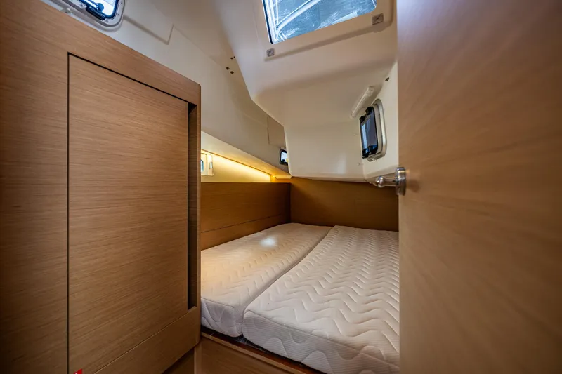 Into The Blue Yacht Photos Pics Interior cabin of 2022 Jeanneau Sun Odyssey 410 yacht with twin beds.