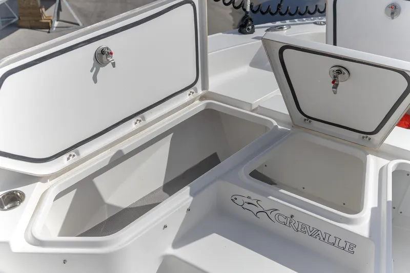  Yacht Photos Pics 2024 Crevalle 26 HCO boat storage compartments with open lids, showcasing interior space.