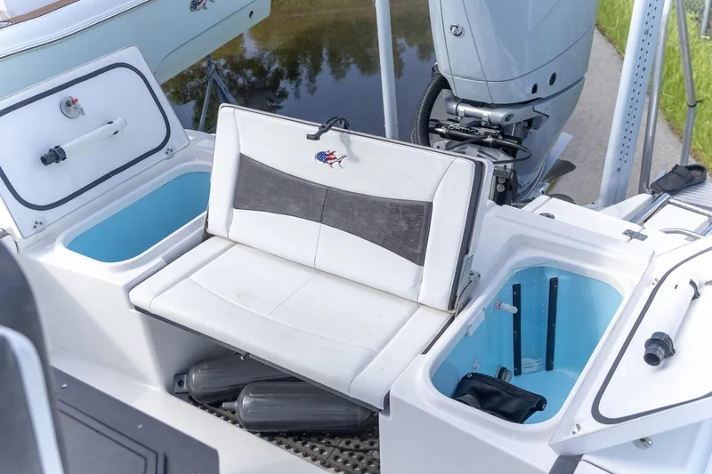  Yacht Photos Pics 2024 Crevalle 26 HCO boat interior with seating and storage compartments.