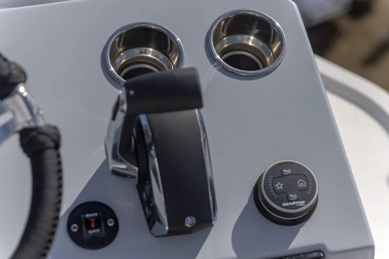  Yacht Photos Pics Control panel of 2024 Crevalle 26 HCO boat with throttle and cup holders.