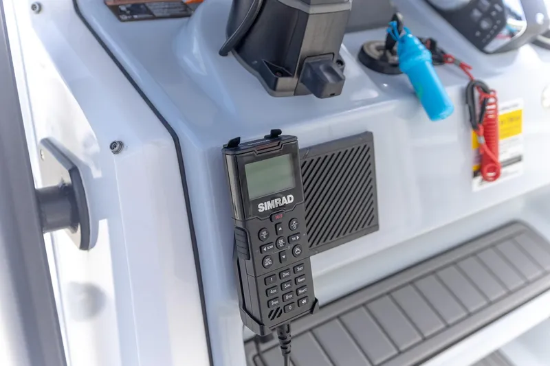  Yacht Photos Pics Simrad radio on 2024 Crevalle 26 HCO boat console, featuring modern marine equipment.