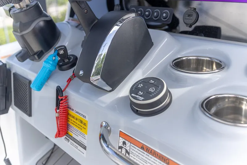  Yacht Photos Pics 2024 Crevalle 26 HCO boat console with controls and cup holders.