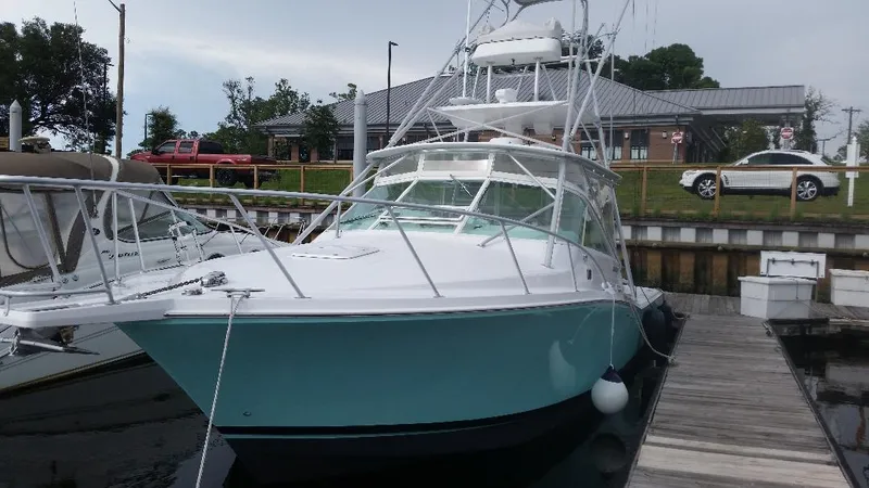 Reely Blessed Yacht Photos Pics 1998 Cabo 31 Express with Tower docked at marina.