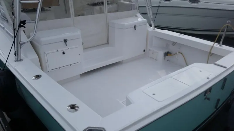 Reely Blessed Yacht Photos Pics 1998 Cabo 31 Express boat with tower, spacious deck.