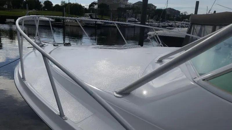 Reely Blessed Yacht Photos Pics 1998 Cabo 31 Express with Tower docked in marina.