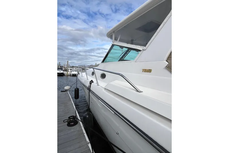 Summah Sled Yacht Photos Pics 1999 Tiara Yachts 4000 Express docked, showcasing sleek design and modern features.