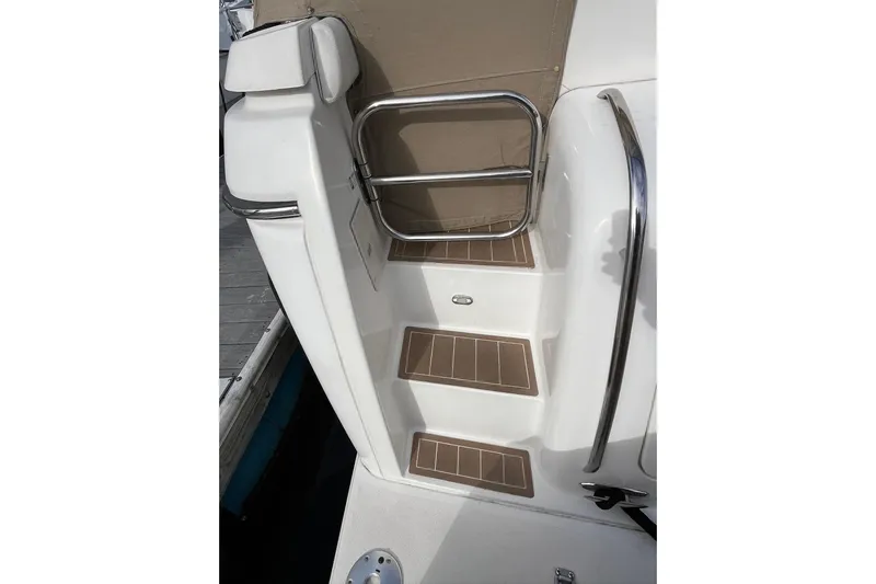 Summah Sled Yacht Photos Pics Steps on a 1999 Tiara Yachts 4000 Express, featuring stainless steel railings.