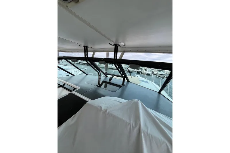 Summah Sled Yacht Photos Pics 1999 Tiara Yachts 4000 Express interior view with marina backdrop.